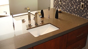 elegant faucet with dark countertop