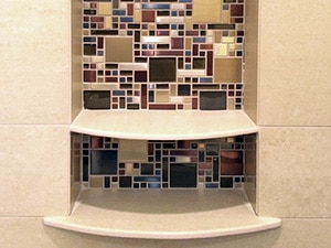 glass tile in shampoo niche with divider