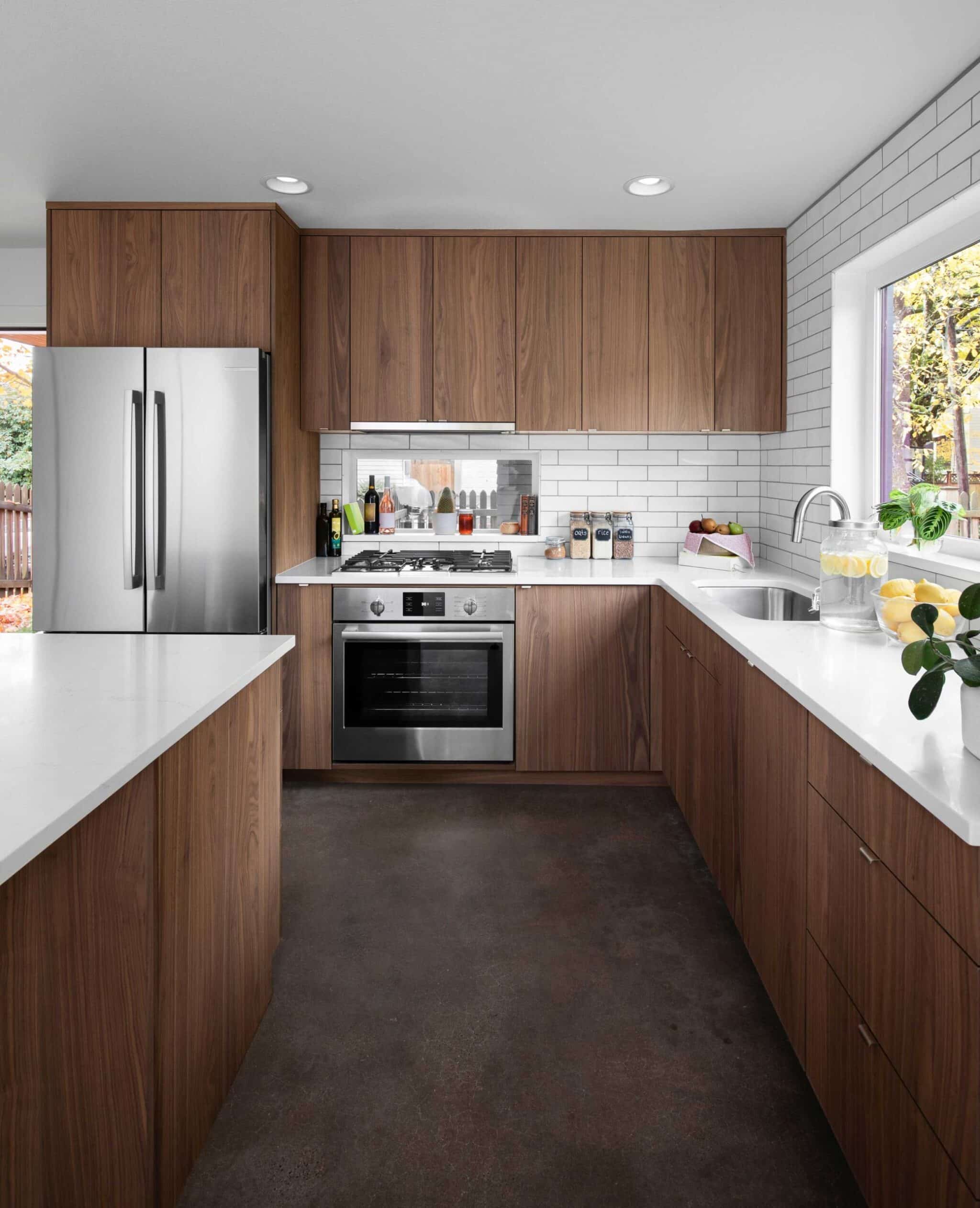 modern kitchen with wood cupboards and white subway tile