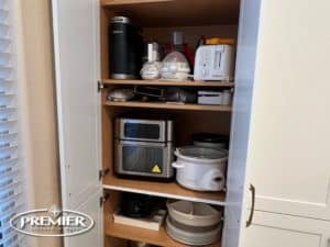 Appliance Garage with neatly organized kitchen appliances inside a cabinet