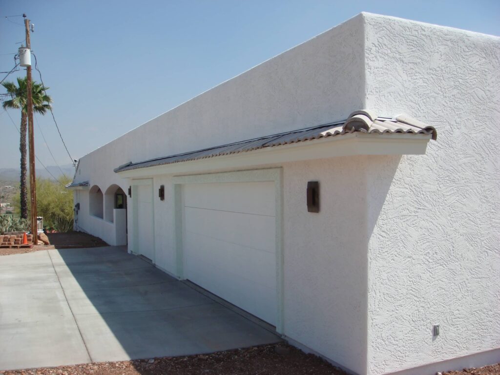White stucco house and garage
